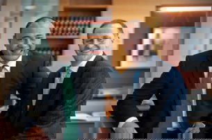 MP for SERCO, Sam Lotu-Iiga, chats with John Key after graduating from the Simon Lusk School of Politics.